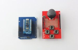 The BLEduino connected to the Shield-Shield, next to a Sparkfun shield